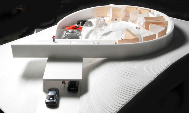 Illustration for article titled This Massive Concrete Loop Is Part House, Part Car Gallery